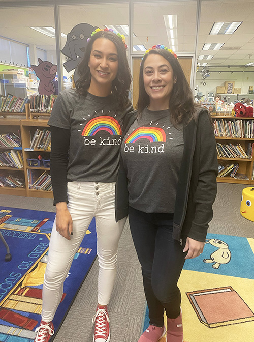 Mrs. Suzanne Lang and Ms. Dara Weiss wearing be kind rainbow t-shirts